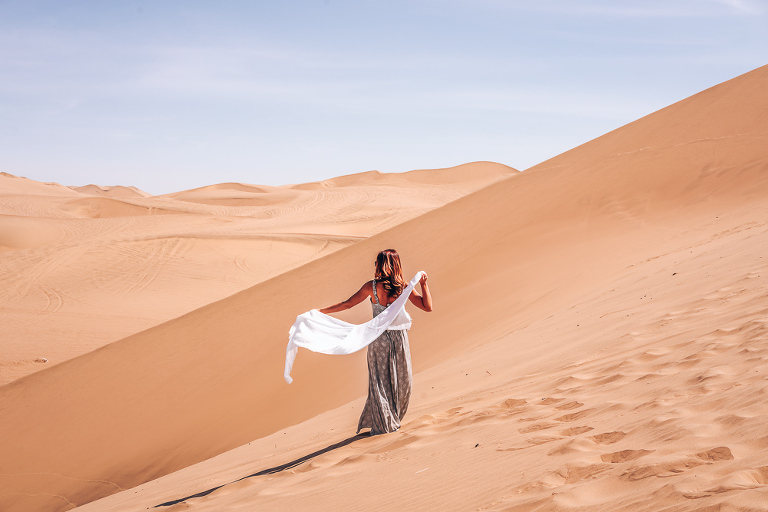 Walking through the desert in Huacachina