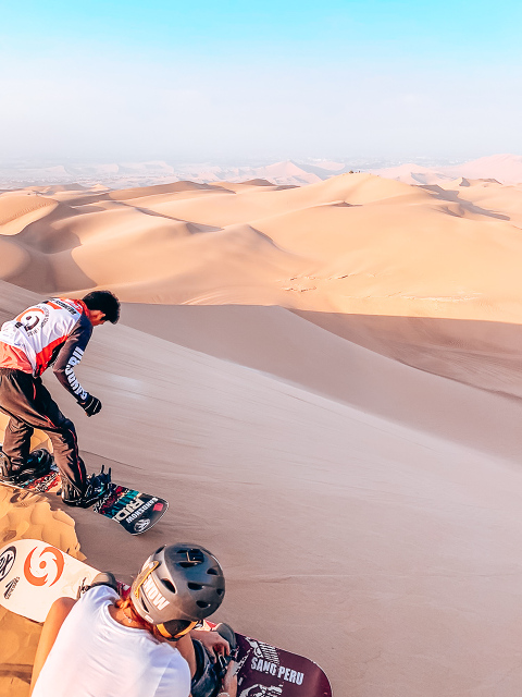 Sitting at the top of the dunes listening to our instructor